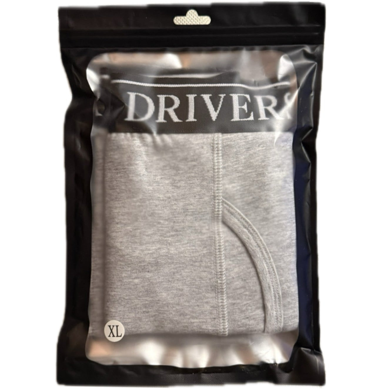 Gray underwear in a clear package with 'DRIVERSEAT' branding on a white background